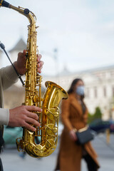 saxophone. saxophone detail in the center of Bucharest, Romania. wind instrument. photo during the...