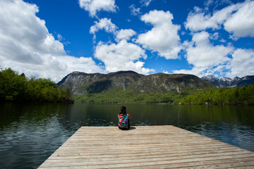 Fototapeta na wymiar Woman enjoying day next to Bohinj lake in Slovenia, 