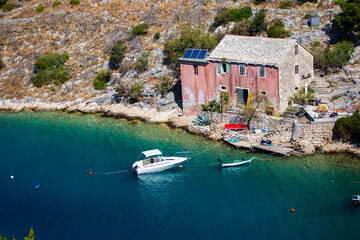 Old Dalmatian traditional fisherman house in bay, Brac island - Croatia - obrazy, fototapety, plakaty