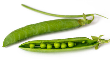 Fresh green peas on a white background