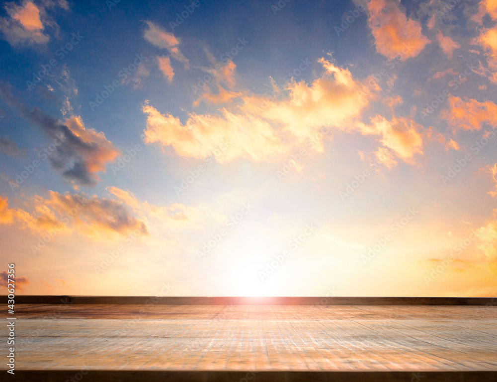 Wall mural empty top of wooden table and view of sunset background