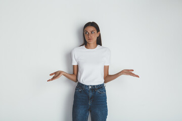 Front view of young woman in jeans and blank white t-shirt