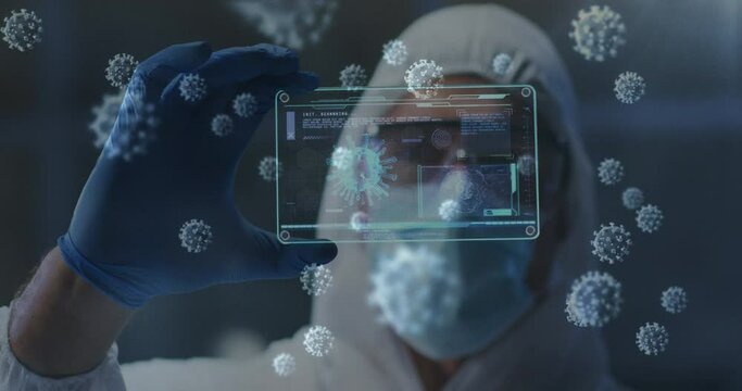 Covid-19 cells floating against health worker holding futuristic screen with medical data processing