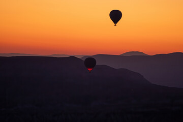 Hot air balloons flying over Cappadocia 