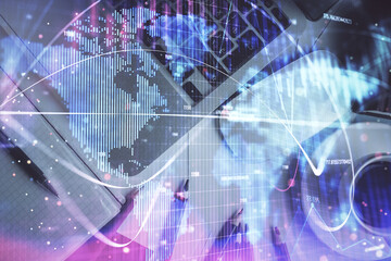 Business theme hologram drawings over computer on the desktop background. Top view. Multi exposure. Concept of international connections.