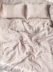 photo of beautiful ecological and natural linen bedding pastel colour with sheet, two pillows and large duvet cover