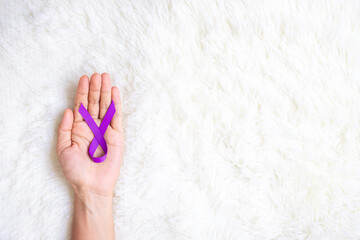 Pancreatic Cancer, world Alzheimer, epilepsy, lupus and domestic violence day Awareness month, Woman holding purple Ribbon for supporting people living. Healthcare and World cancer day concept