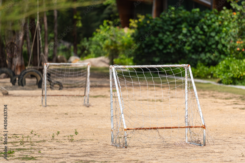 Wall mural Beach football or beach soccer sand pitch with goal. Outdoor sport field amd equipment photo.