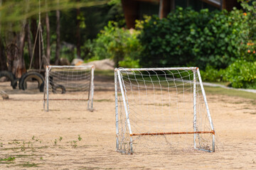 Beach football or beach soccer sand pitch with goal. Outdoor sport field amd equipment photo.