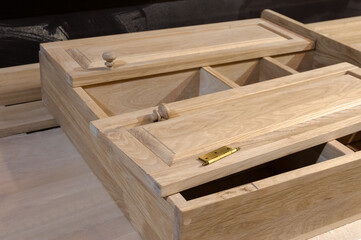 the cabinet is handmade from natural wood in light colors. Furniture manufacturing