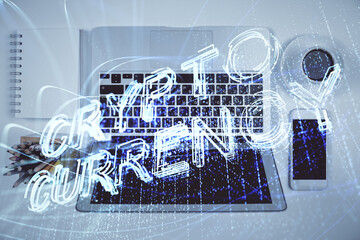 Blockchain theme hologram drawings over computer on the desktop background. Top view. Double exposure.