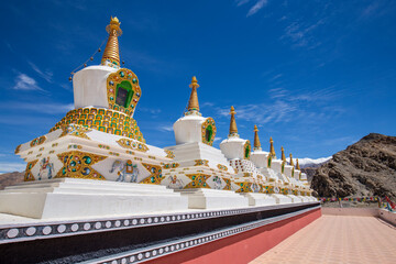 White buddhist stupa or pagoda in tibetan monastery near village Leh in ladakh, noth India
