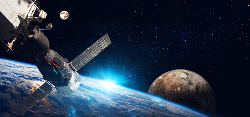 Obraz na płótnie Canvas Space station on orbit of the Earth planet and universe background. Elements of this image furnished by NASA