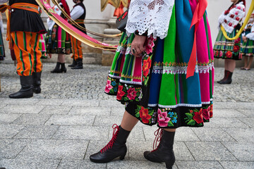 People dressed in polish national folk costumes from Lowicz region during annual Corpus Christi...