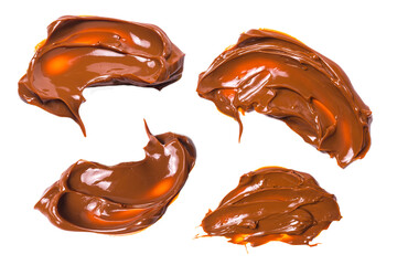 Melted tasty caramel splashes isolated on white background.