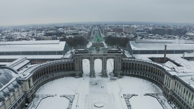 Aerial view of Arc du Cinquantenaire, a stately triple arch monument in wintertime, Brussel, Belgium.