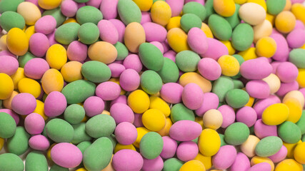 Group of colorful peanuts in glaze.