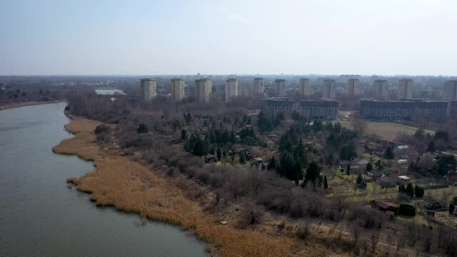 4k footage of residential buildings over Lake Czerniakowskie Nature Reserve Lake in Warsaw city, Poland
