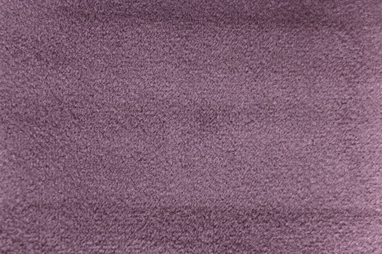 Plum colour velour textile sample. Fabric texture background