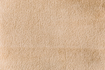 Wheat colour velour textile sample. Fabric texture background