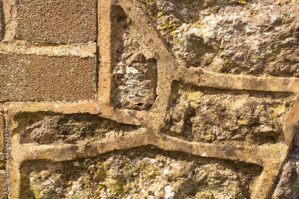 Sticker orange raised pointing used between stone and brick construction of building