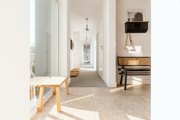 Stylish retro furniture in elegant bright corridor of trendy home