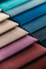 Collection of colorful velour textile samples. Fabric designed for sofas and armchairs. Fabric texture background