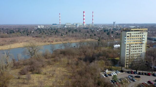 Lake Czerniakowskie Nature Reserve Lake in Warsaw city, Poland, view with Siekierki Power Station, 4k drone video