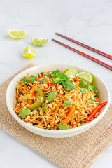Thai Peanut Noodles with Vegetables, Top Down Asian Food Vertical Photo
