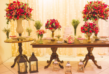 cake table decorated with flowers for wedding