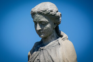 Fototapeta na wymiar Statue in abandoned cemetery 