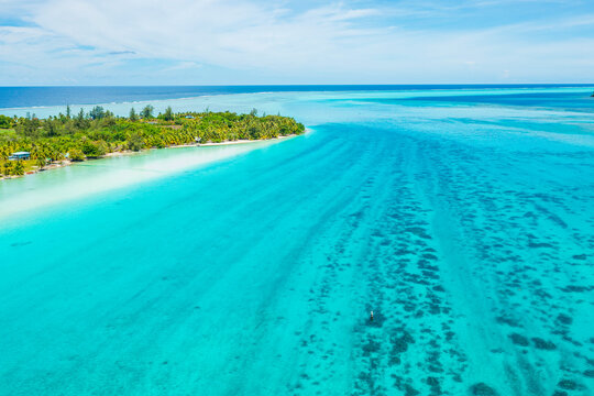 Climate Change An Rising Sea Levels Concept Photo French Polynesia. Global Warming And Rising Sea Levels Are A Threat To Huahine Depicted In Image, Tahiti And Other Island Nations. Travel Destination.