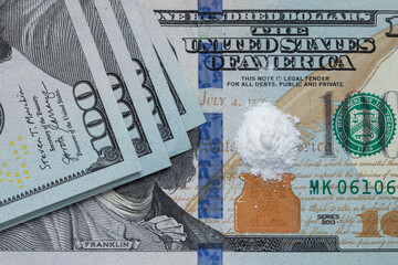 A pile of white drugs on one hundred US Dollar bill