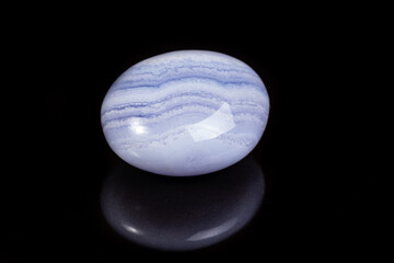 Macro mineral stone blue agate on black background