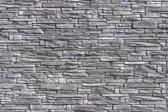 detail of marble wall, made of wild stone, stone wall with gray blocks, stone texture