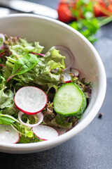vegetables salad radish, cucumber, mix leaves petals meal snack keto or paleo diet vegan or vegetarian food copy space food background rustic. top view