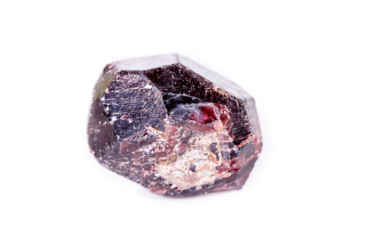 Macro of a mineral garnet stone on a white background