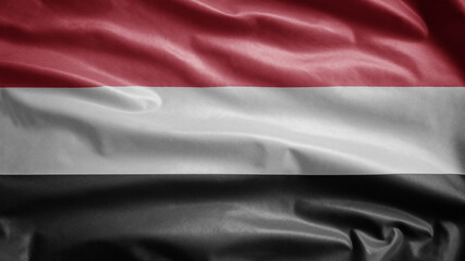 Yemeni flag waving in the wind. Yemen banner blowing soft silk.