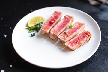 tuna grilled seafood fried barbecue fish second course meal snack  keto or paleo  pescetarian diet vegetarian food copy space food background rustic. top view
