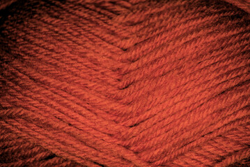 Macroscopic photo of red ropes woven into a tight ball