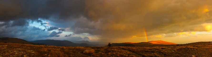 Outstanding panoramic view of Parang Mountains, rainbow, extreme weather, Ranca resort, Novaci, famous high altitude Transalpina road, Gorj County, Romania