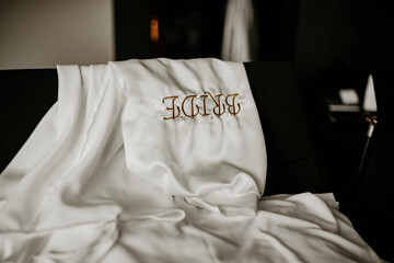 wedding details for bride and maid of honor pink and white bathrobes preparations	