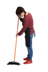 side view of a woman sweeping on white background