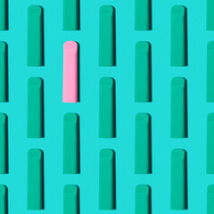 Colorful pattern disposable electronic cigarette pod on a blue background. alternative to modern...