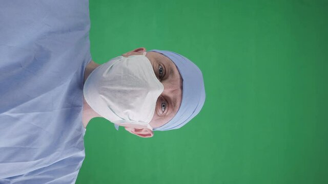 Doctor closes plastic bag with a dead body inside. A corpse in a black plastic bag in a hospital morgue. POV view, green screen background.