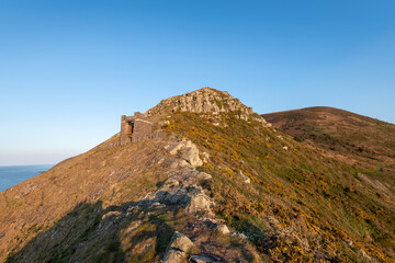 Fototapeta na wymiar Landscape photo of the old coastguard watch tower at Hurlstone Point in Exmoor National Park