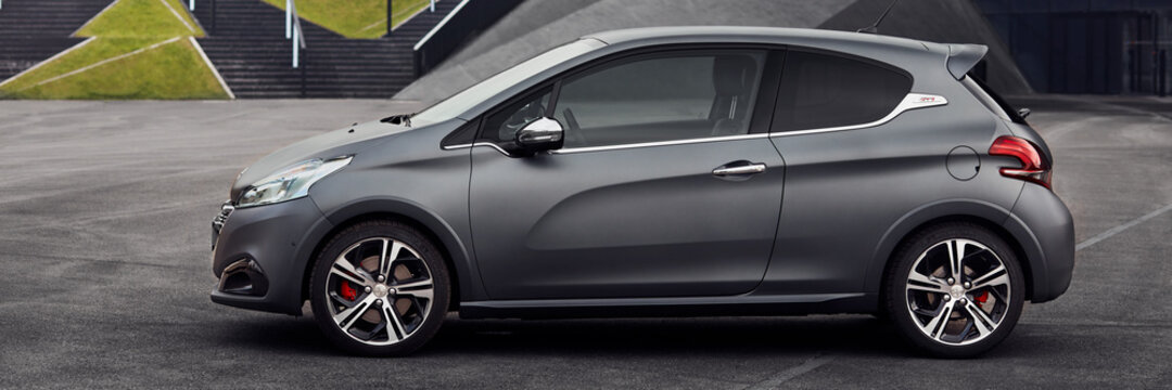 Peugeot 208 GTI stands in front of a building Convention Center. Katowice, Poland - 05.05.2016