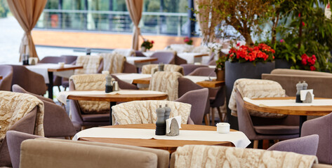 Obraz premium Restaurant or cafe with cozy interior. View of modern dinning room interior