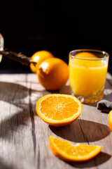 Obraz na płótnie Canvas table full of fresh oranges and juice in springtime