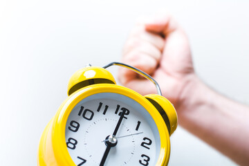 Fist Turning Off Alarm Clock At 6 O'Clock In The Morning